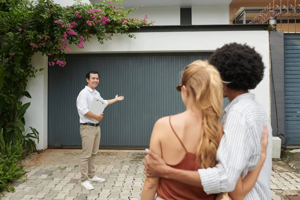 Real estate agent showing a house to a couple